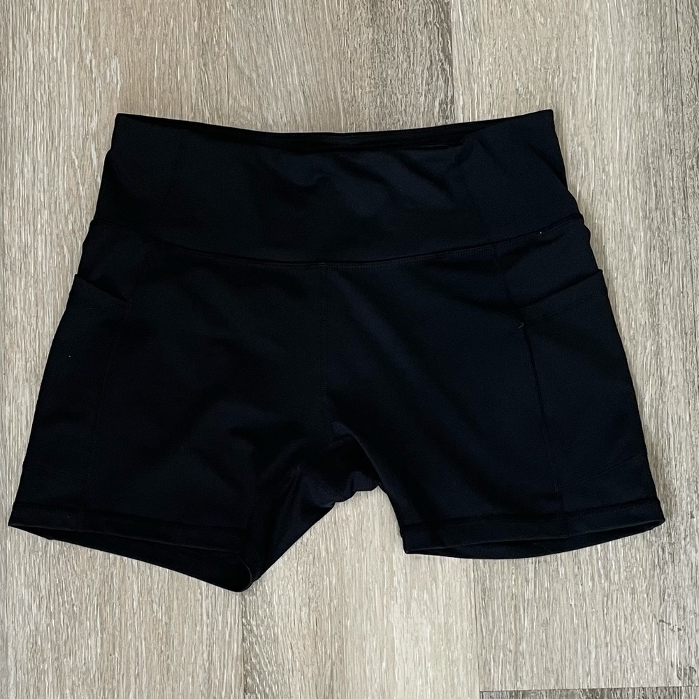 Never worn! Biker shorts with pockets. Size L